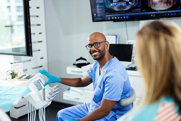Janitorial crew in uniform disinfecting exam room counters and medical equipment in a Pembroke Pines healthcare office