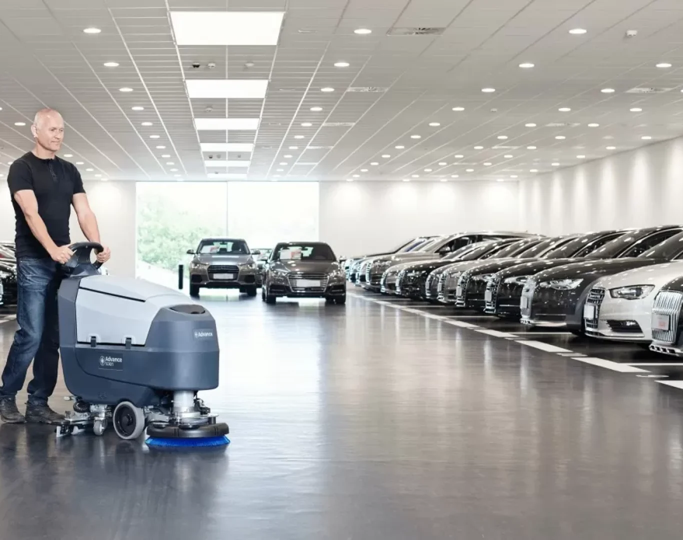 licensed dealership cleaning team working inside busy Pembroke Pines FL showroom
