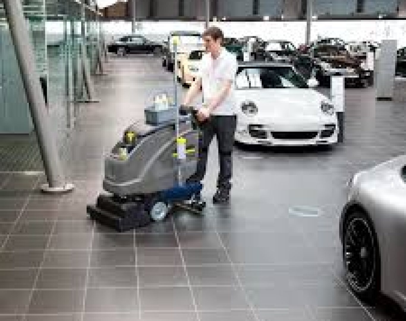 licensed dealership cleaning team working inside busy Pembroke Pines FL showroom