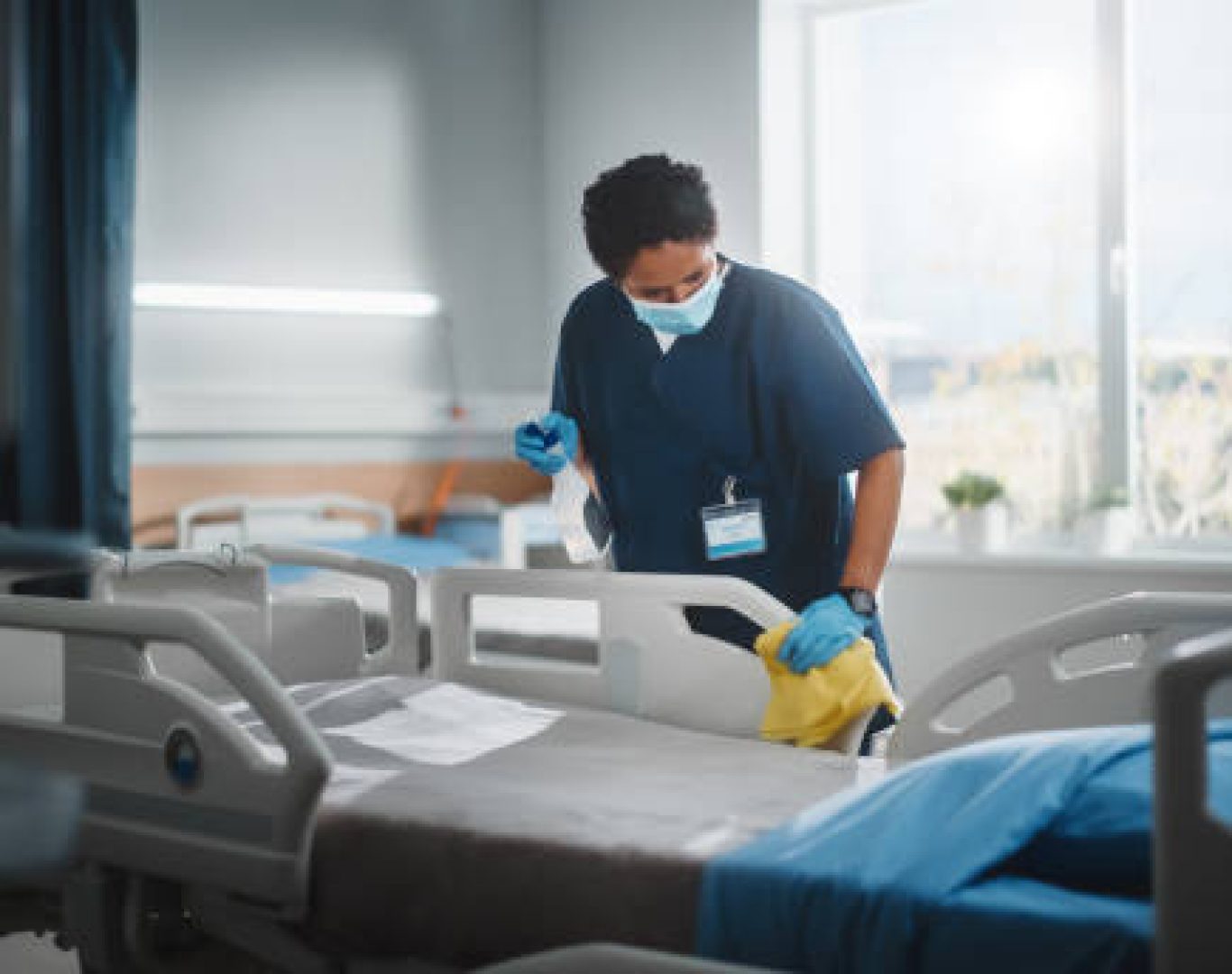 Experienced technician using medical-grade disinfectants in a Fort Lauderdale doctor's office with strict attention to safety protocols