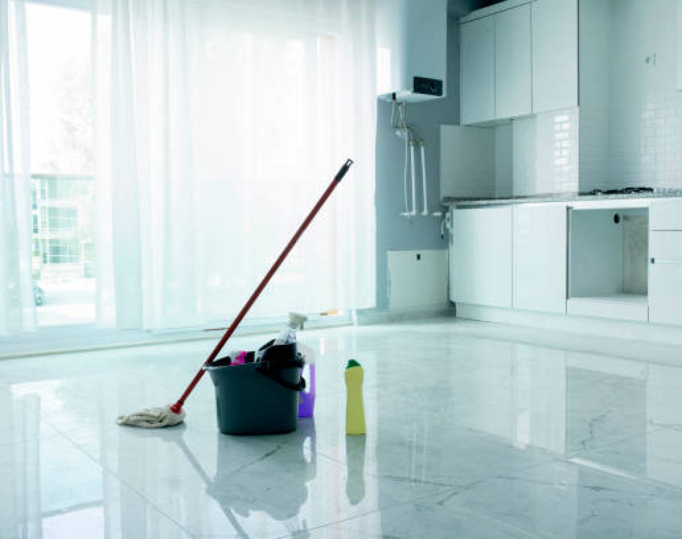 Janitorial crew mopping retail store floor and sanitizing counters in Homestead, FL after closing hours