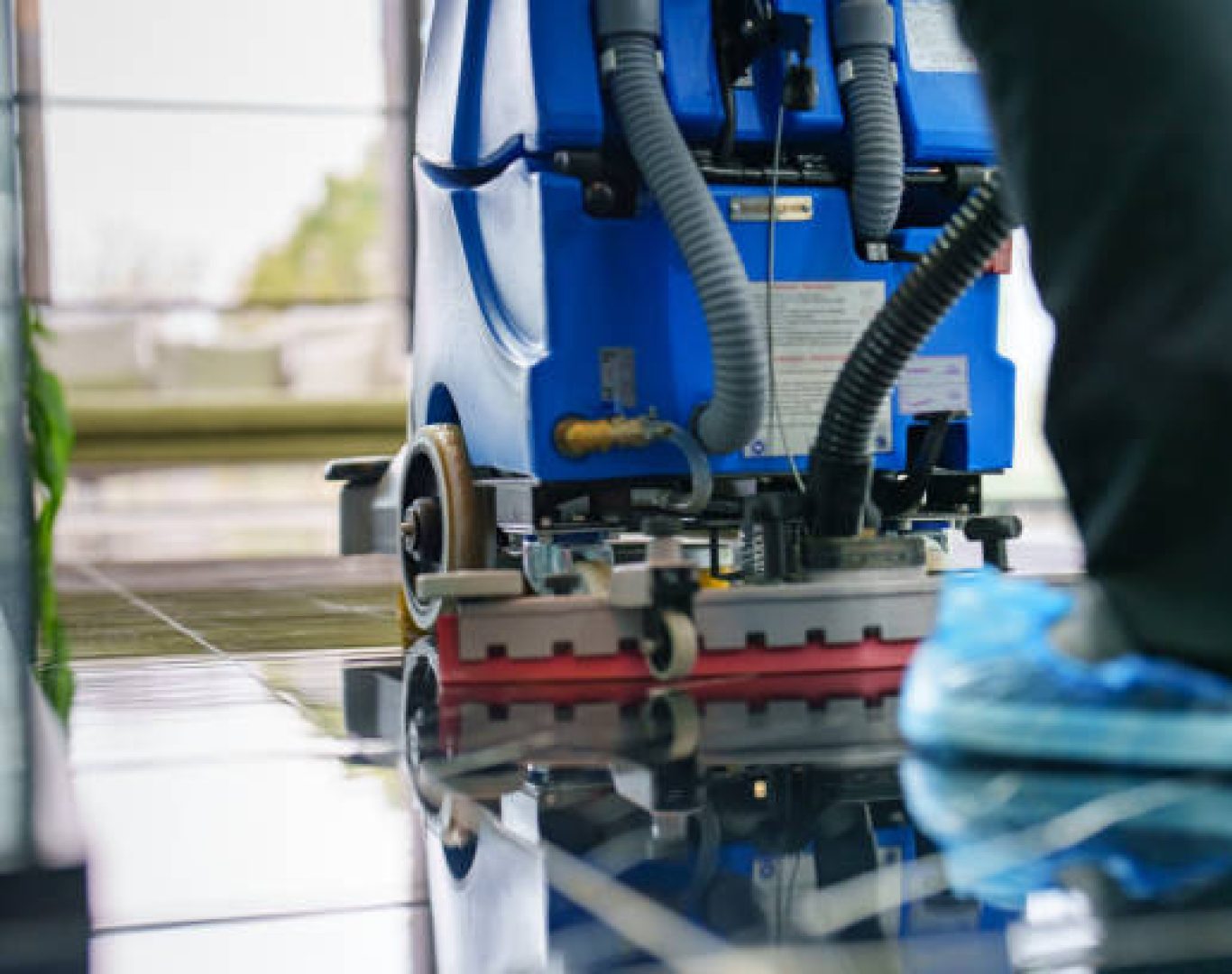 Licensed office cleaning professionals disinfecting workspace for T & M Services INC.