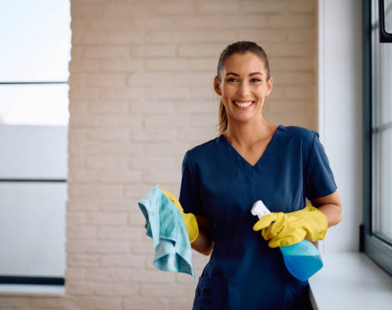 Professional cleaners sanitizing workstations and conference rooms