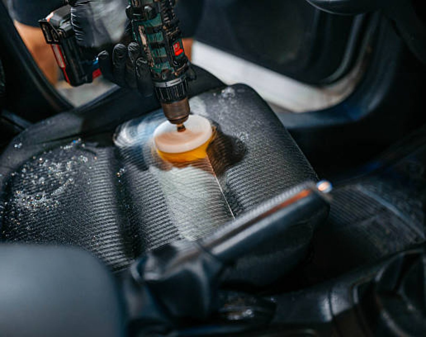 Auto dealership cleaning crew disinfecting high touch surfaces daily