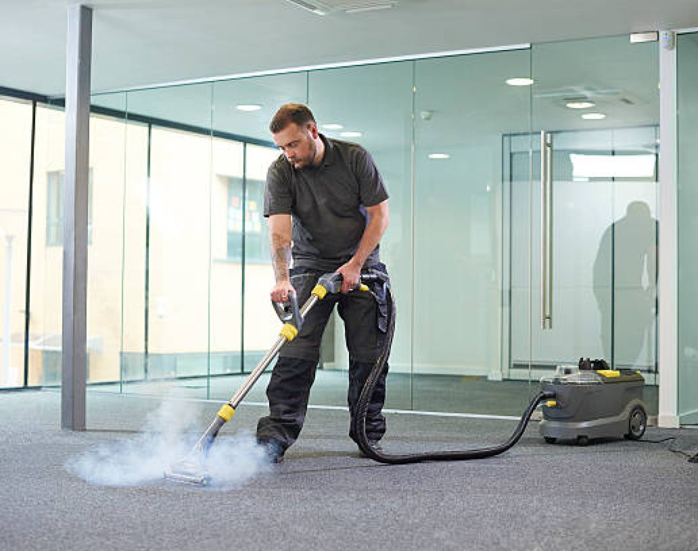 Office janitors performing licensed cleaning services through T & M Services INC.