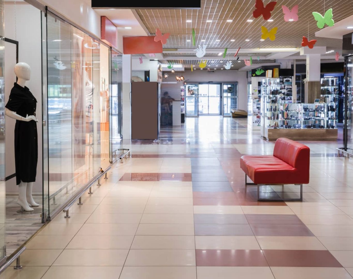 Retail cleaning professional sanitizing a store entrance in South Florida